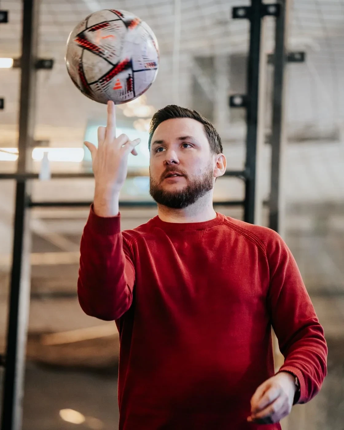 Sean Diehl balancing a football on one finger
